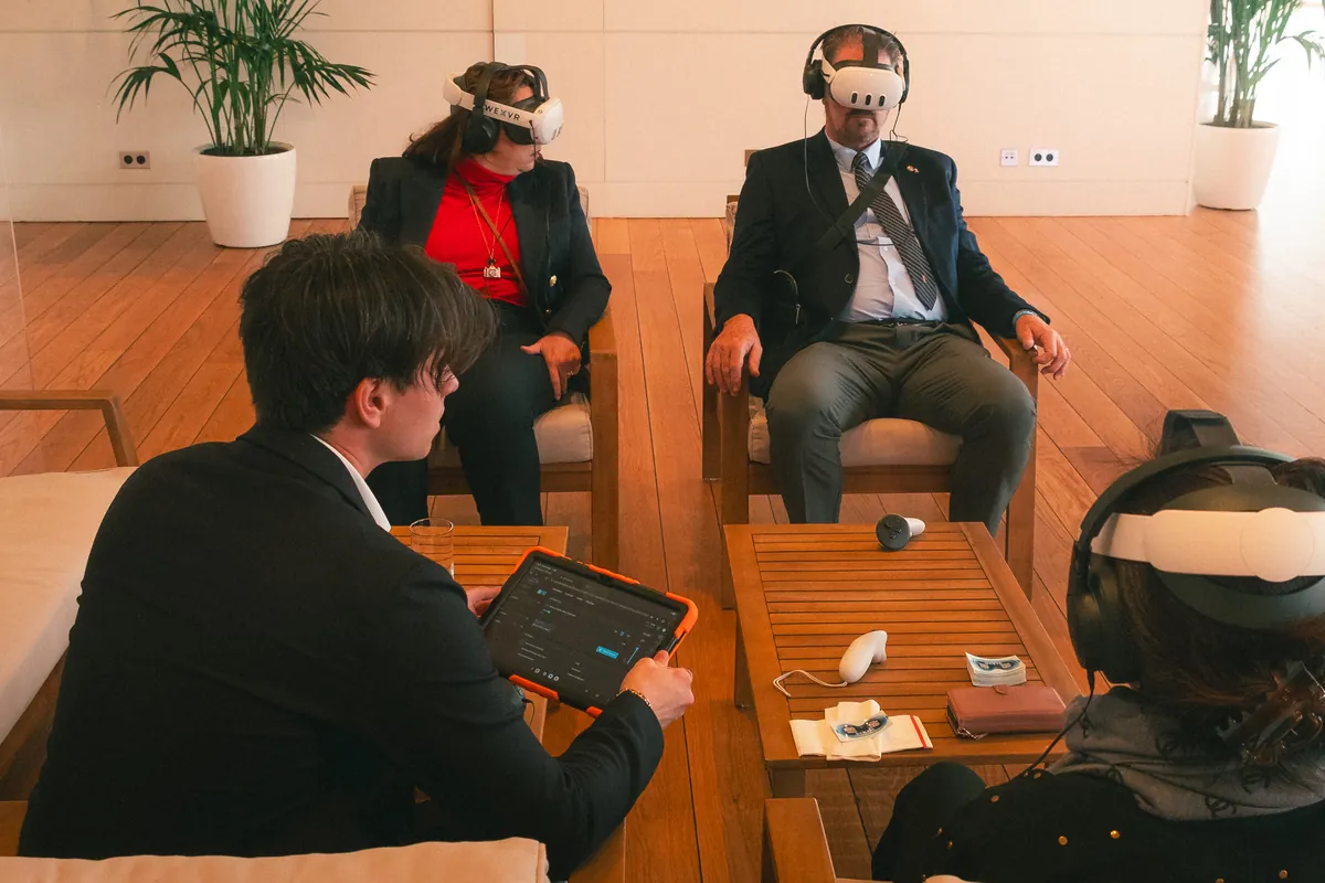 A WHTEXCH operator guiding guests through a WEXVR session at Yacht Club de Monaco